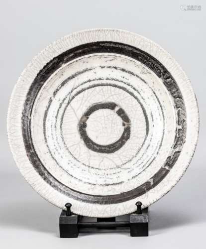 ROBIN WELCH (1936-2019); a large raku dish partially covered...