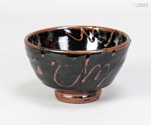 TAKESHI YASUDA (born 1943); a stoneware chawan covered in te...