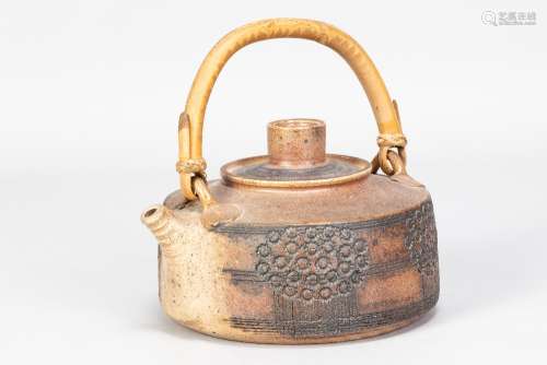 MARY RICH (born 1940); an early stoneware teapot with cane h...