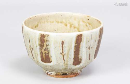 MIKE DODD (born 1943); a stoneware footed bowl covered in gr...