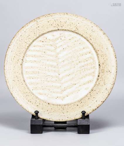 DAVID LLOYD JONES (1928-1994); a stoneware plate covered in ...