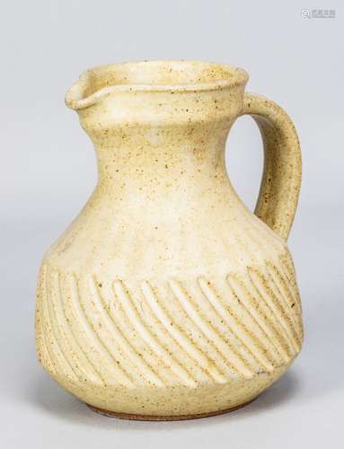 Aylesford Friars Pottery; a fluted stoneware jug covered in ...