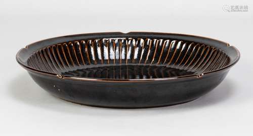 POH CHAP YEAP (1927-2007); a fluted stoneware dish covered i...