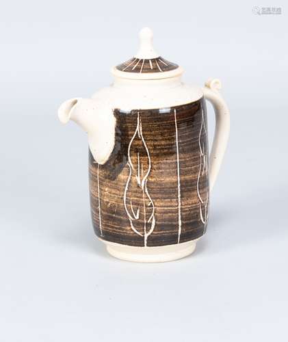 Odney Pottery; an earthenware coffee pot partially covered i...