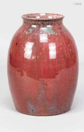 Ruskin Pottery; a high fired stoneware vase covered in mottl...