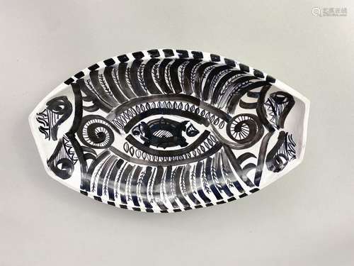 PAMELA NASH (died 1986); a large earthenware dish with black...