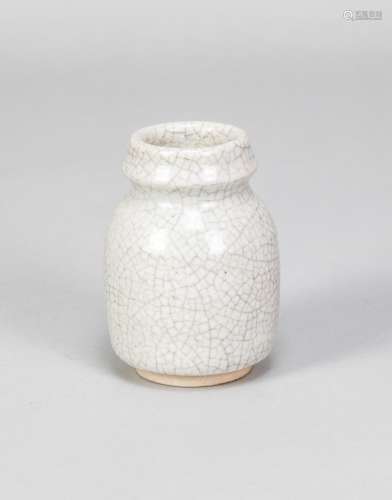 CONSTANCE DUNN; a small stoneware vase covered in white crac...