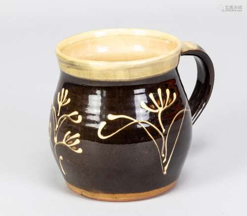 PAUL BARRON (1917-1983); a slipware mug with floral decorati...