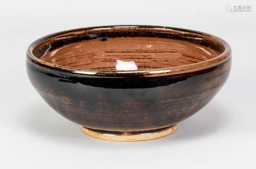 URSULA MOMMENS (1908-2010); a stoneware bowl covered in tenm...