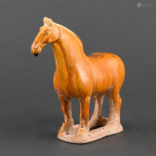 AN IMPRESSIVE AMBER-GLAZED POTTERY HORSE