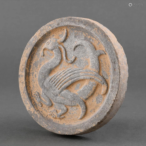 A POTTERY 'THE SOUTH SUZAKU' ROOF-TILE END