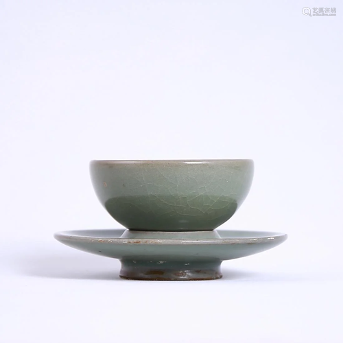 A CELADON-GLAZED CUP AND STAND