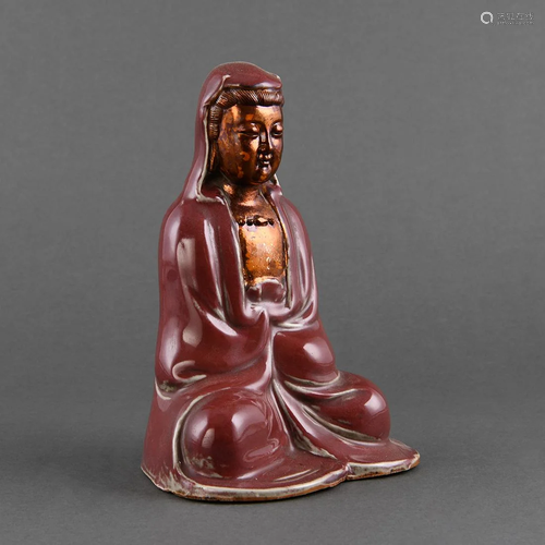 A BROWN-GLAZED AND GILT FIGURE OF GUANYIN