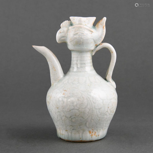 A RARE QINGBAI 'PHOENIX-HEAD' 'PEONY' EWER