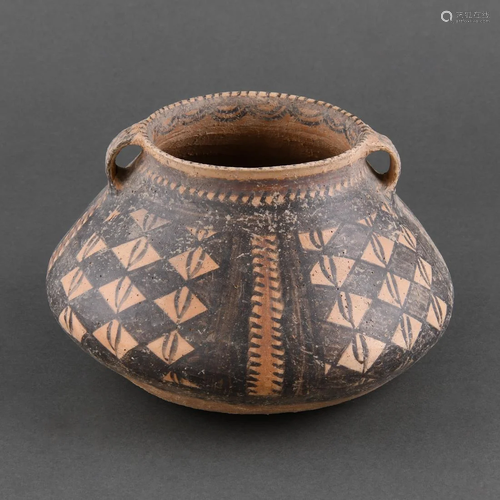 A MAJIAYAO PAINTED POTTERY HANDLED JAR