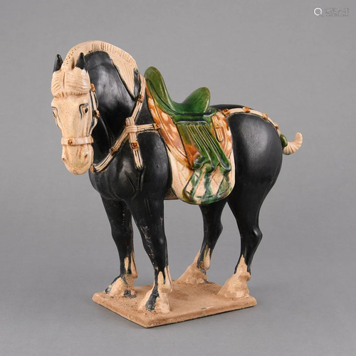 A SANCAI FIGURE OF A CAPARISONED HORSE