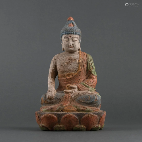 A POLYCHROME AND CARVED WOOD BUDDHA