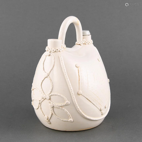 A UNUSUAL MOLDED 'XING' WHITE-GLAZED FLASK