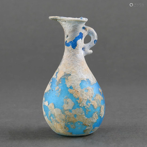 A SMALL BLUE GLASS EWER