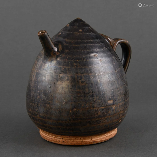 A 'CIZHOU' BLACK-GLAZED PEACH-FORM EWER