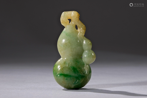 A Carved Jadeite Double Gourd Pendant