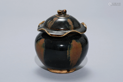 A Black Glazed Jar with Lotus Shaped Lid