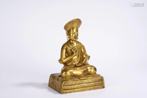 A Sino Tibetan Gilt Bronze Figure of Panchen Lama