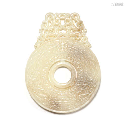 A Carved White Jade Dragon Ornamengt Bi