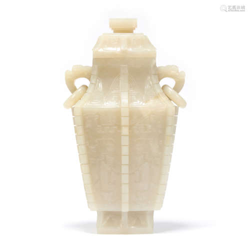 A Carved White Jade Double Loop-Handle Vase And Cover