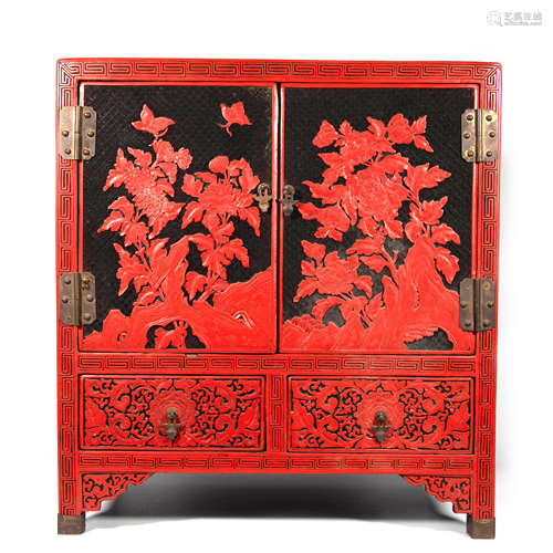 A Carved Cinnabar Lacquer Cabinet