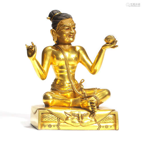 A Gilt Bronze  Seated Master