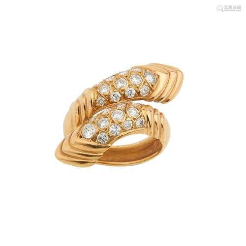 Bague croisée en or jaune 18K (750/°°), ornée de godrons, ce...