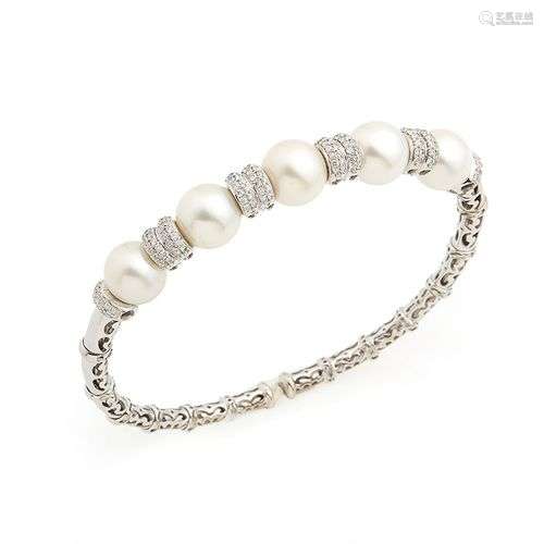 Bracelet jonc semi rigide en or gris 18K (750/°°), orné de p...