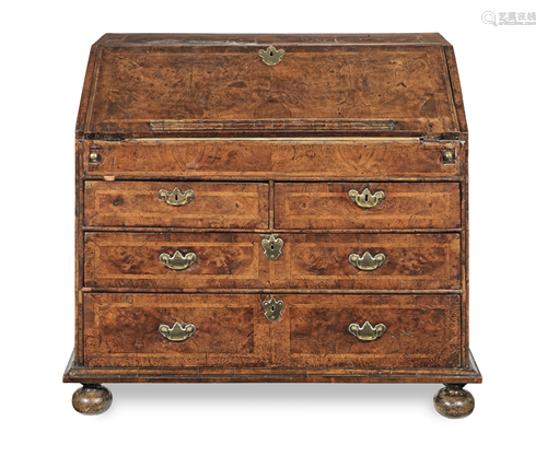 A QUEEN ANNE WALNUT AND FEATHERBANDED BUREAU