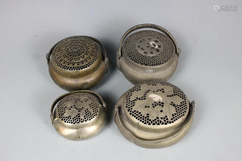 Four Brass Hand Warmers