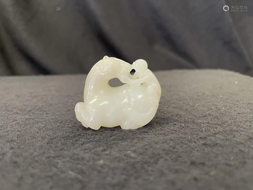 A Carved Hetian Jade 'Monkey on Horse' Pendant