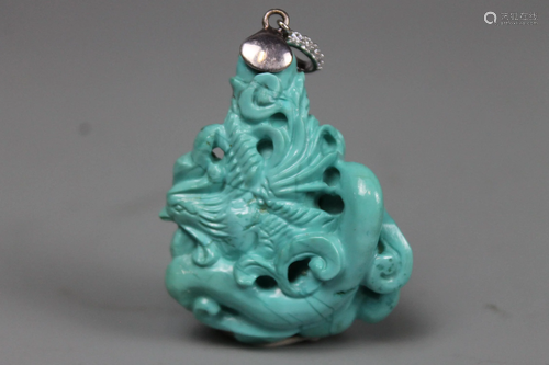 A Carved Turquoise 'Dragon' Pendant, Weight 26 grams