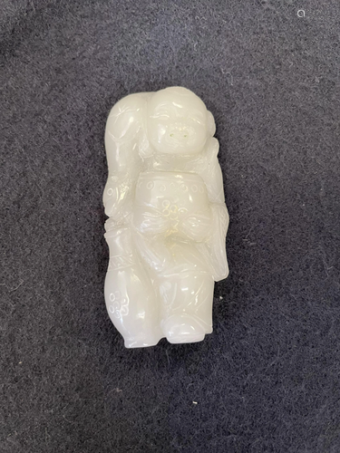 A Carved Hetian Jade Figurine