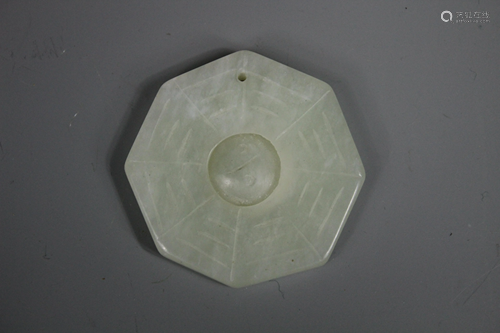 A Carved Hetian Pendant