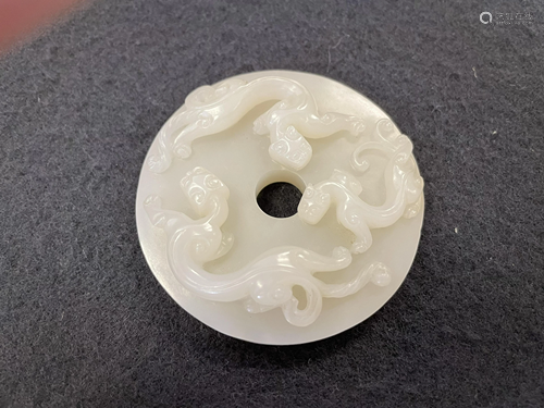 A Carved Hetian Jade 'Dragon' Pendant