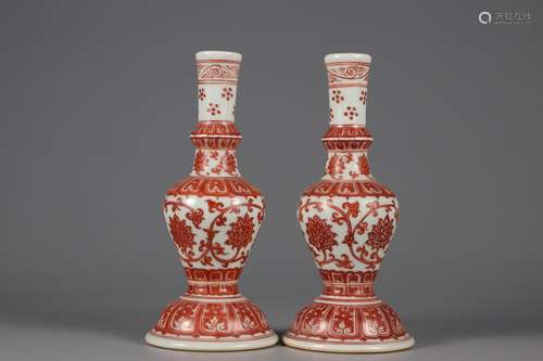 A pair of flower candle holders of alum red tangled lotus in...