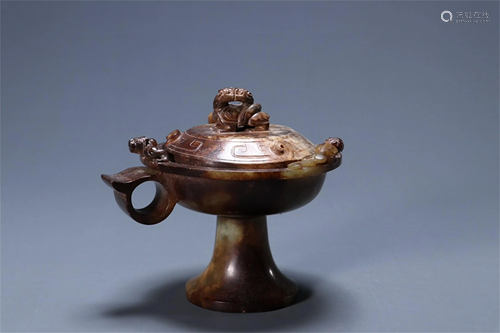 A Chinese Carved Jade Candlestick