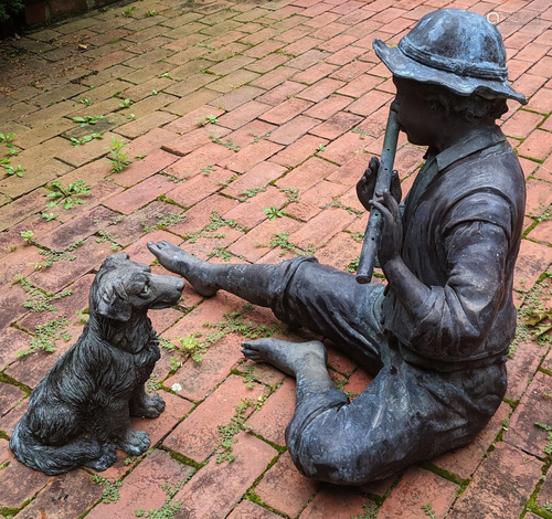 Bronze Sculpture of Boy with Flute & Dog