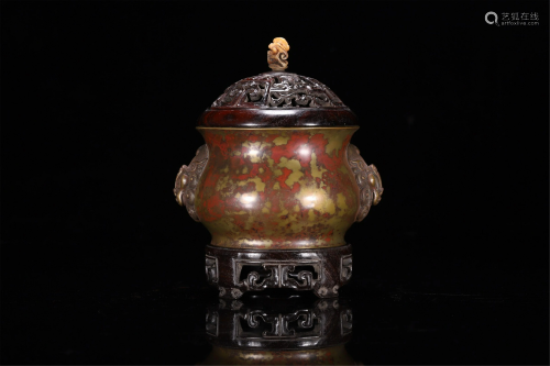 A CHINESE CIRCULAR INCENSE BURNER WITH LION HAND…