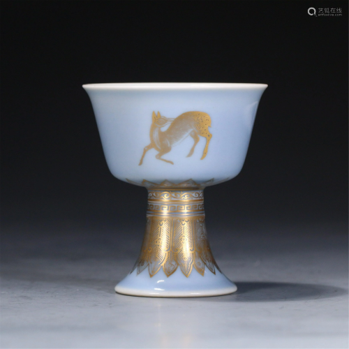 A CHINESE BLUE GLAZE GOLD-PAINTED PORCELAIN STEM CUP