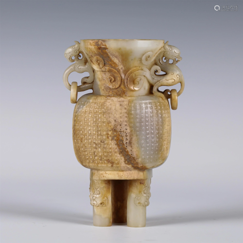 A CHINESE JADE CARVED TRIPOD VESSEL WITH DOUBLE HAND…