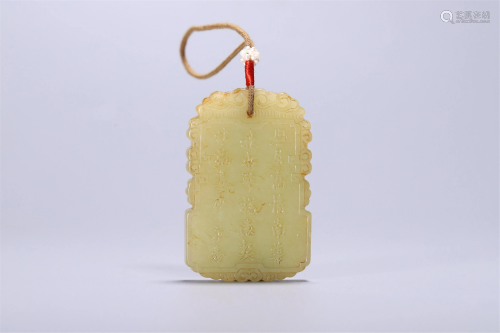 A CHINESE INSCRIBED YELLOW JADE LOTUS PENDANT