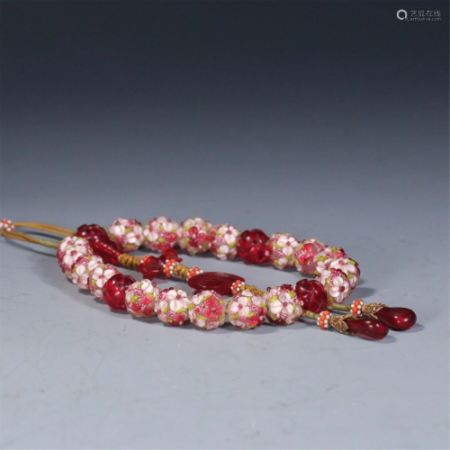A STRING OF CHINESE POLYCHROME GLASS PRAYER BEADS