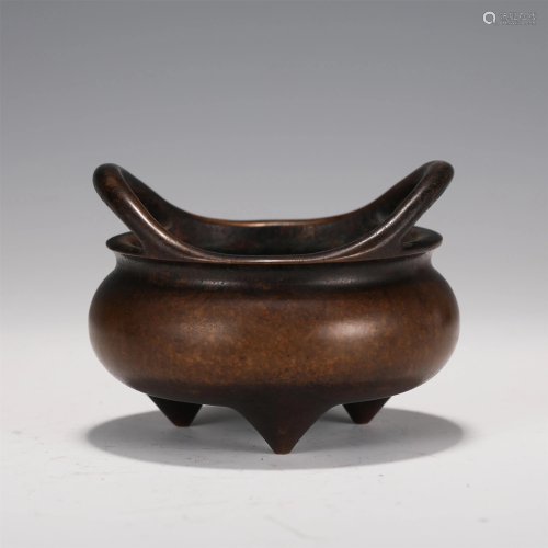 A CHINESE DOUBLE HANDLED BRONZE TRIPOD INCENSE BURNER