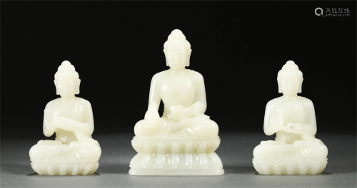 A GROUP OF THREE CHINESE JADE BUDDHA STATUETTES
